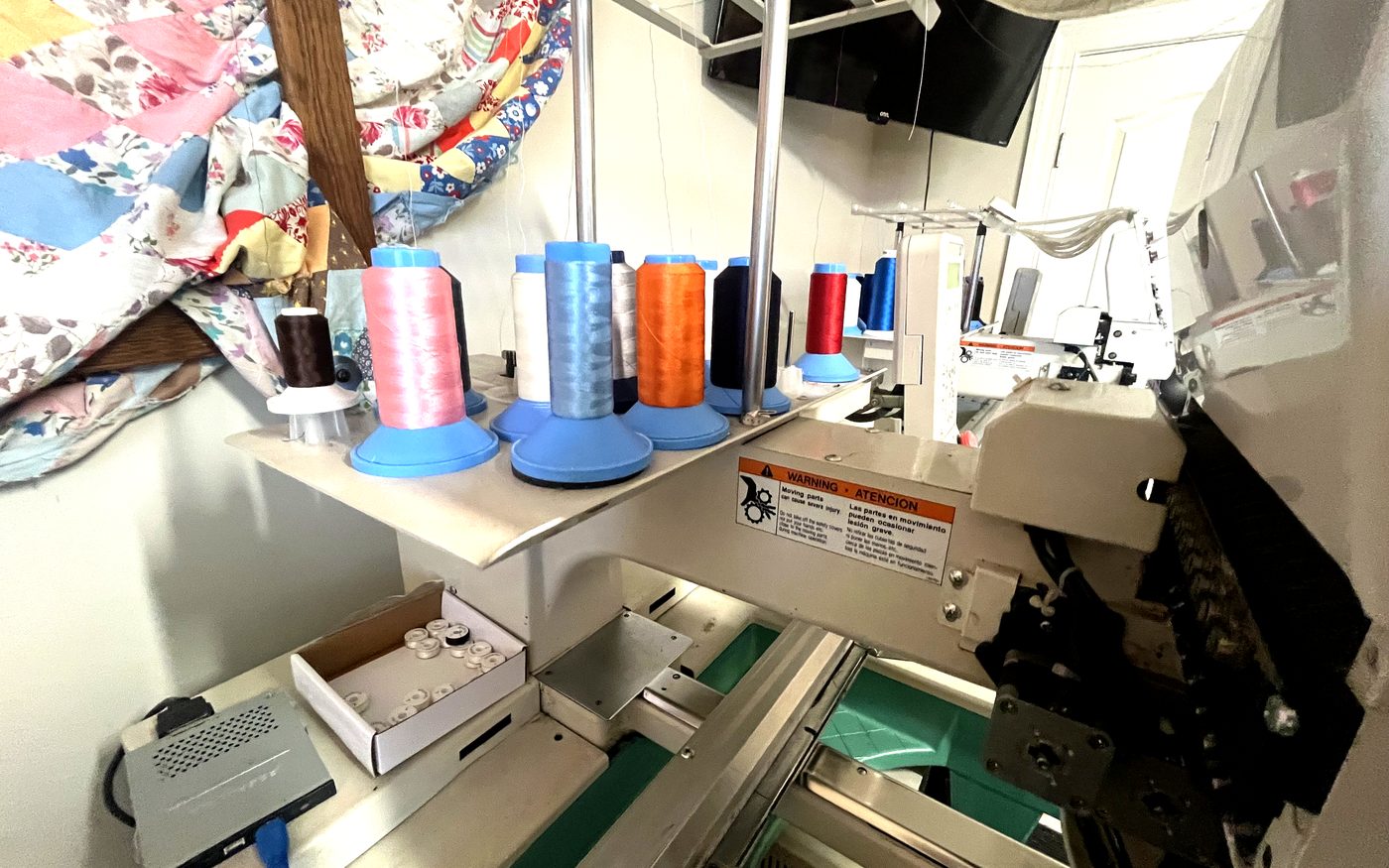 Embroidery studio with machine and thread setup