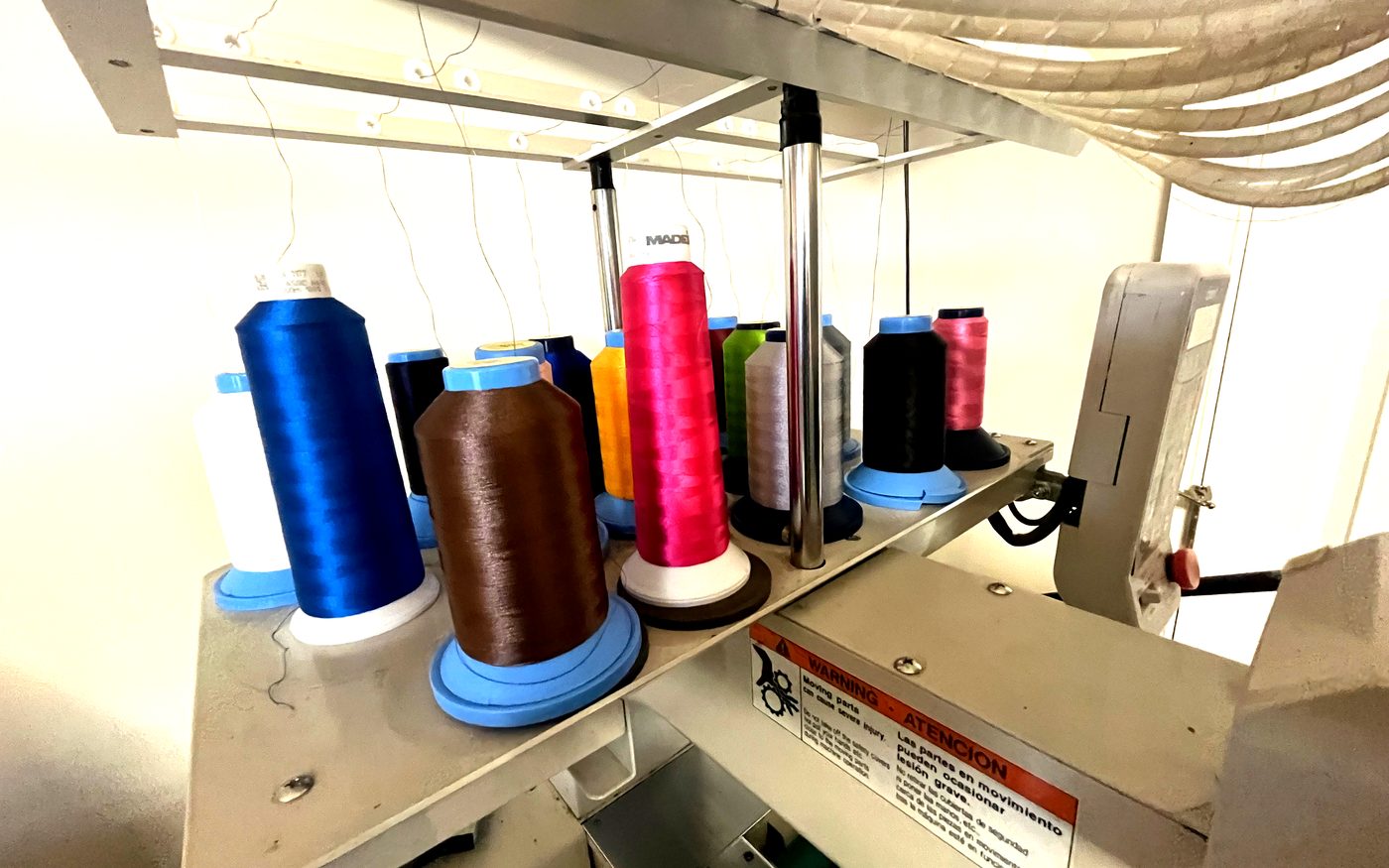 Colorful thread spools loaded on embroidery machine